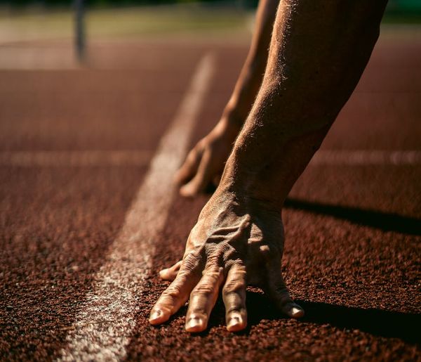 Close up of an athlete breathing deeply before starting a strength routine